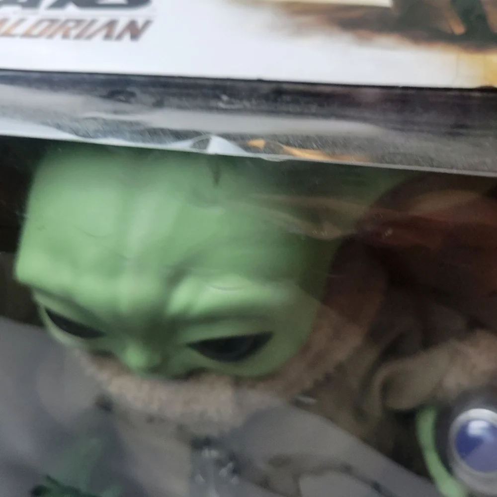Mandalorian toy with accessories grogu
